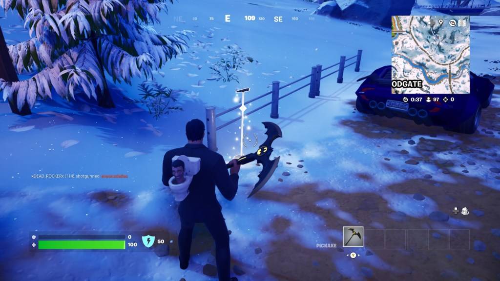 A microphone stand near a metal fence in Fortnite.